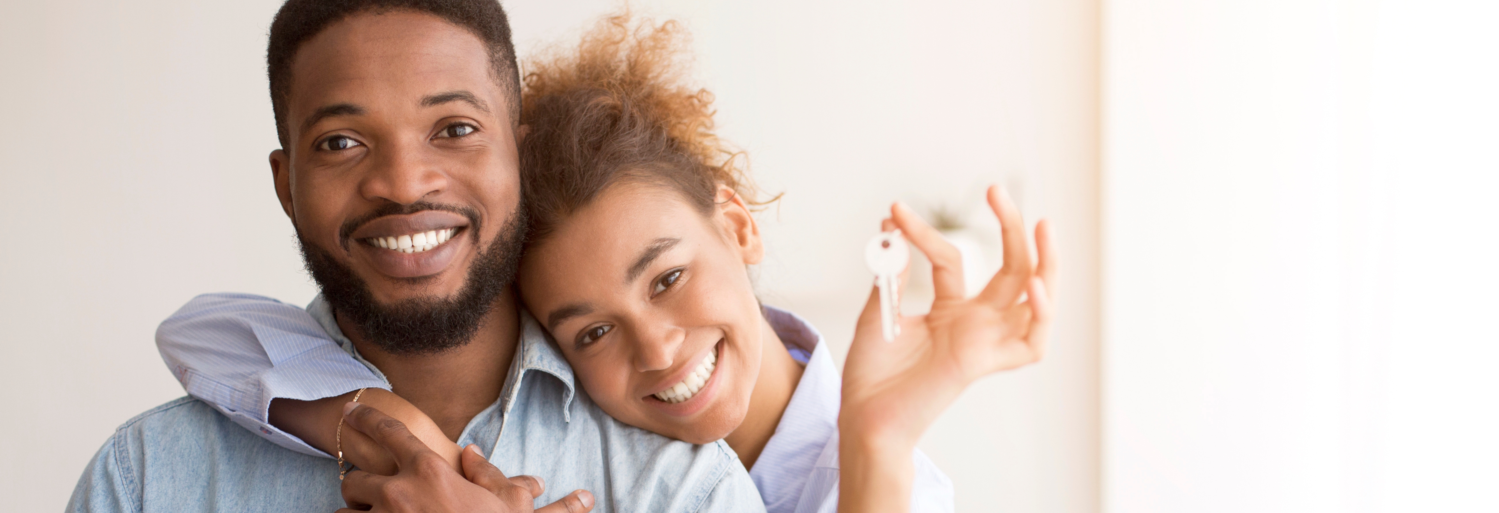 Couple holding house keys